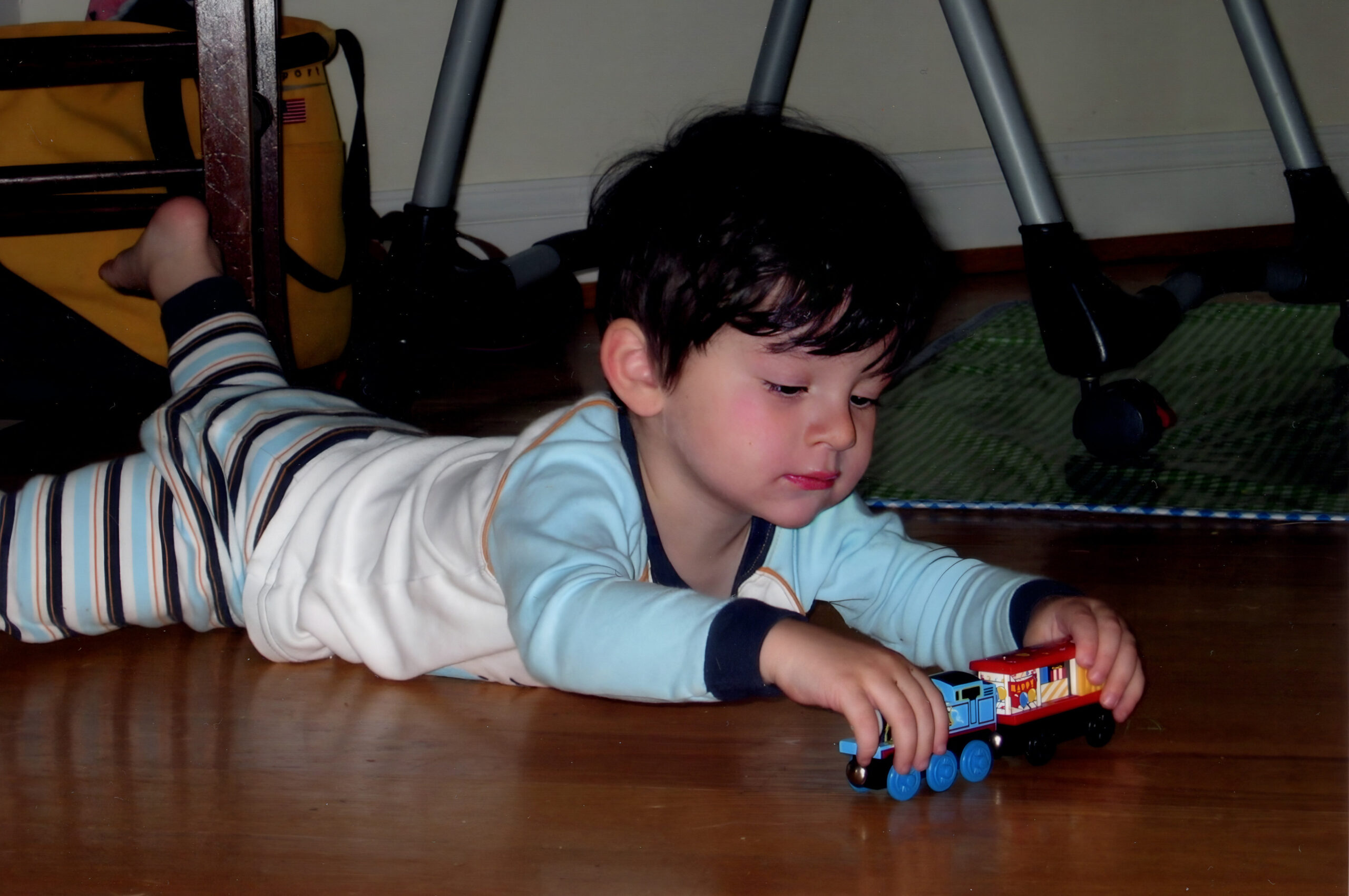 Mikey playing with toy trains