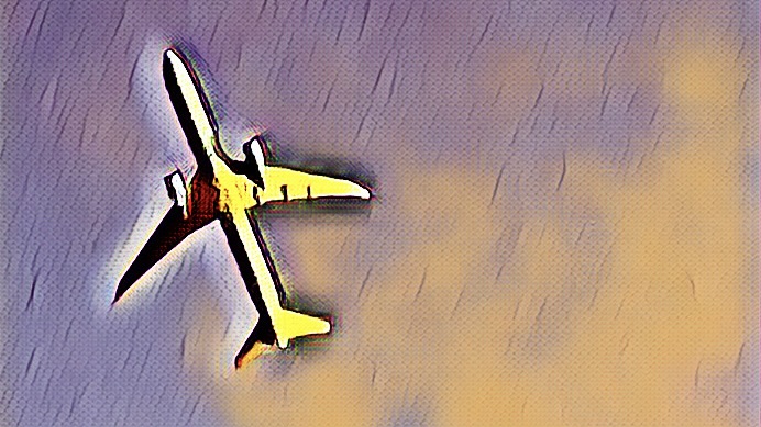 An airplane with the sky in the background, taken from the ground.