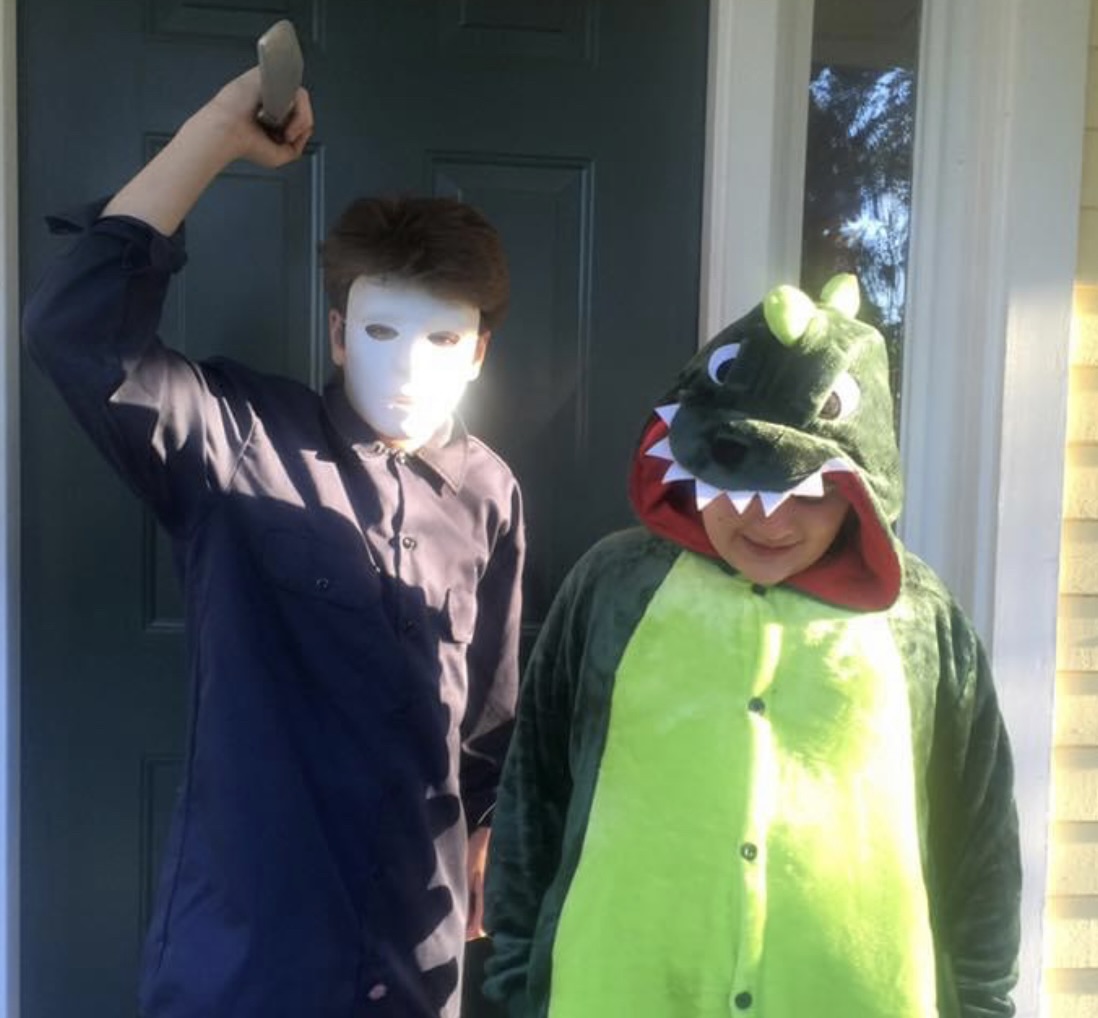 Will dressed as Michael Myers and Michael dressed as a dragon.