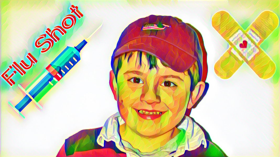 Michael's smiling face with a flu shot sticker and a sticker of two criss-crossed bandaids with a heart.