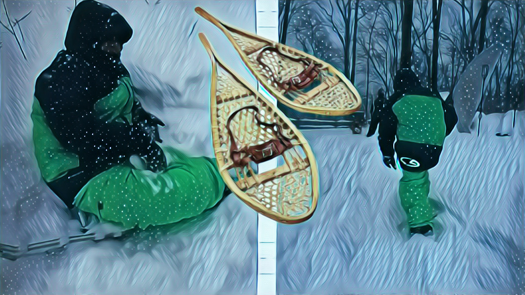 Mikey snowshoeing and then sitting for a break in the snow. A sticker of old fashioned snowshoes added for effect.