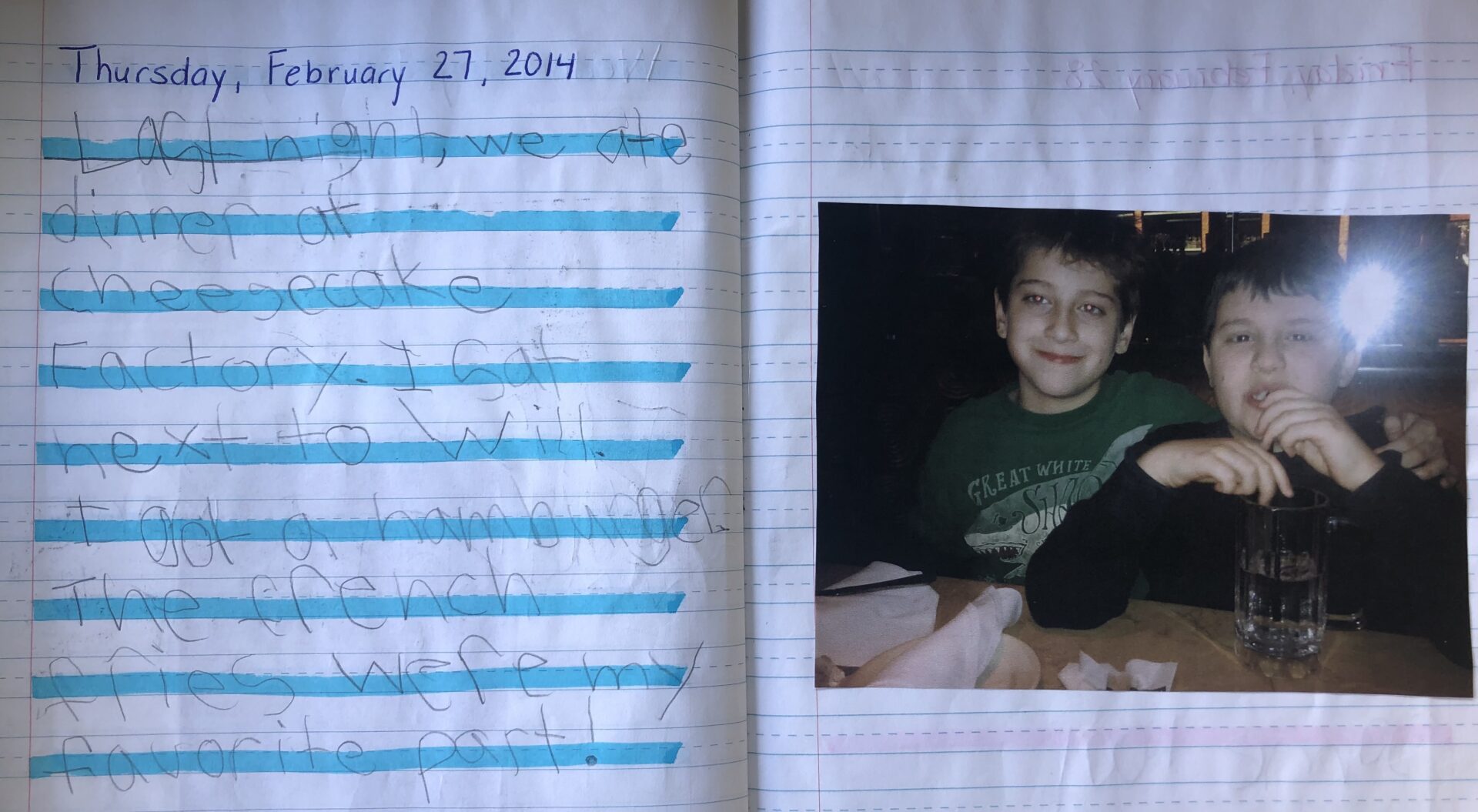 Journal entry from Feb 27 2014. Photo of Will and Mikey at Cheesecake Factory. "Last night we ate dinner at Cheesecake Factory. I sat next to Will. I got a hamburger. The French fries were my favorite part."