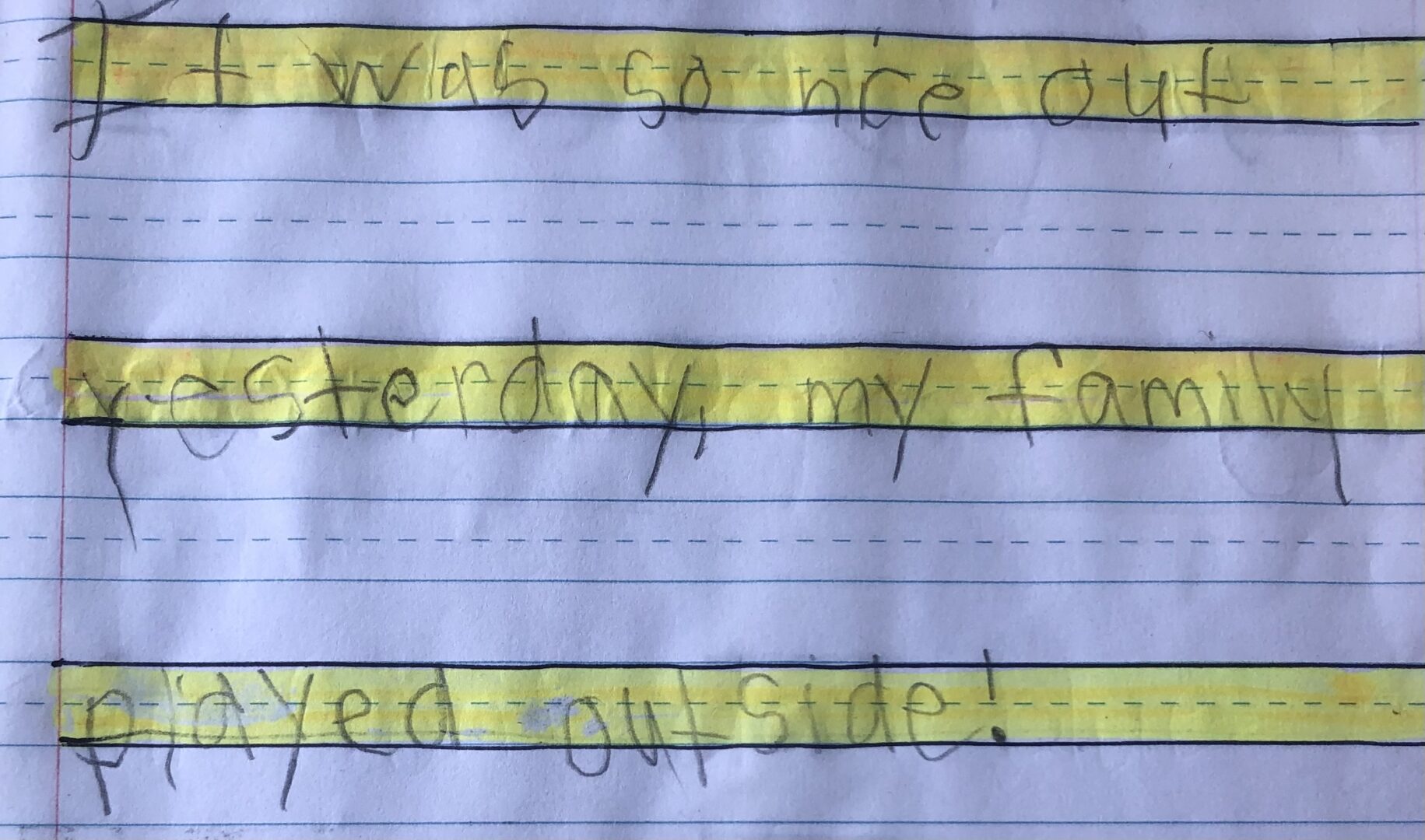 Journal entry. Writing only on lined paper highlighted. "It was so nice out yesterday, my family played outside!"