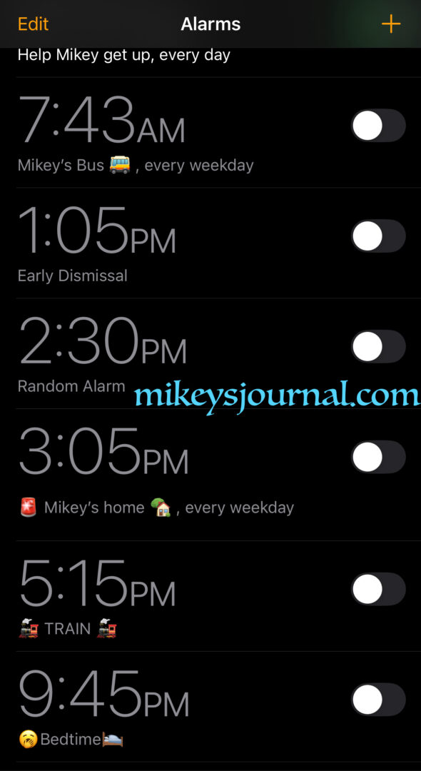 screenshot of the list of my alarms on my phone.7:43 Mikey's bus every weekday with a bus emoji, several others and then, 9:45 PM Bedtime with a bed emoji and a yawn emoji