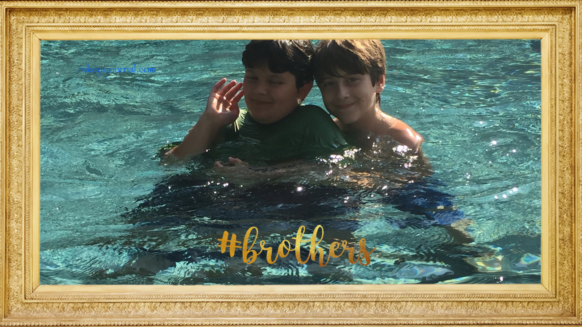 gold framed photo of Will and Mikey with #brothers in gold.