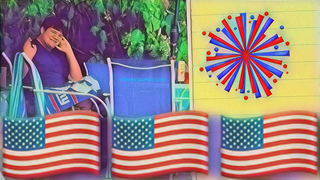 Current photo of Mikey sitting outside, American flags and a red and blue starburst for decoration.