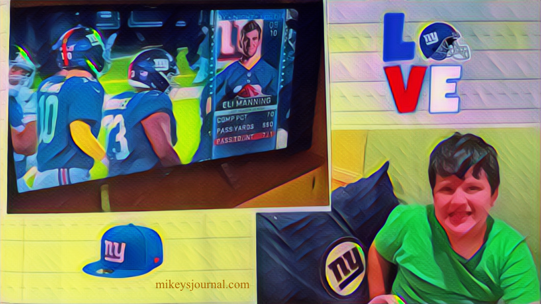 stylized photo of Mikey watching the giants (screen showing Eli Manning) with his Giants pillow.