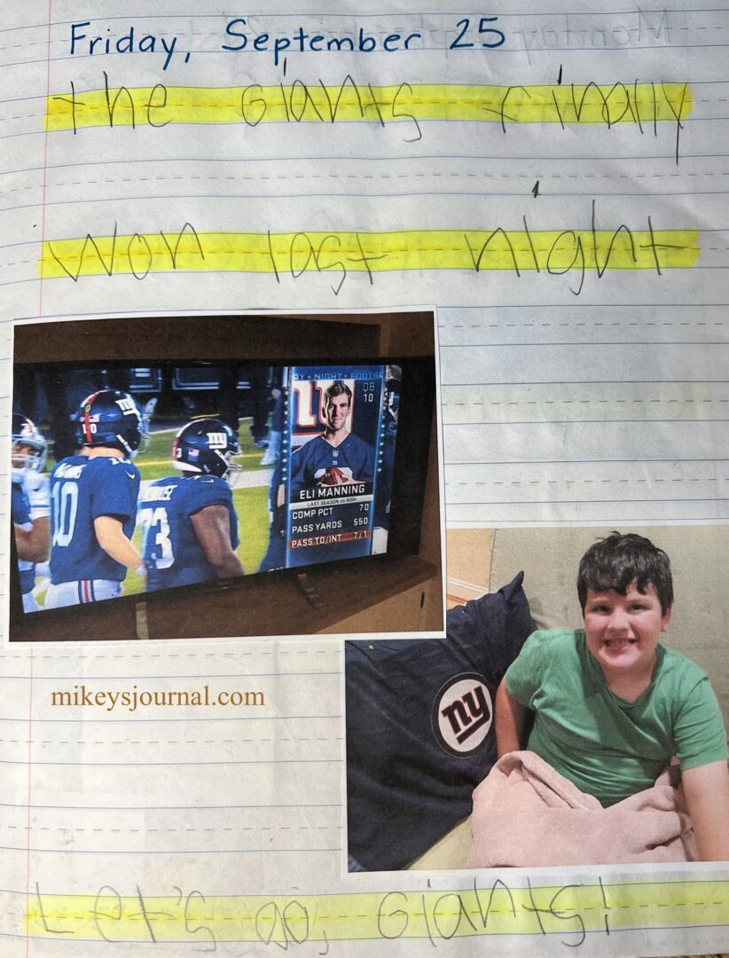 journal entry Friday, September 25 "The Giants finally won last night. Let's go Giants!" photo of Eli Manning on the TV screen, photo and Mikey watching with his giants pillow and a fleece blanket