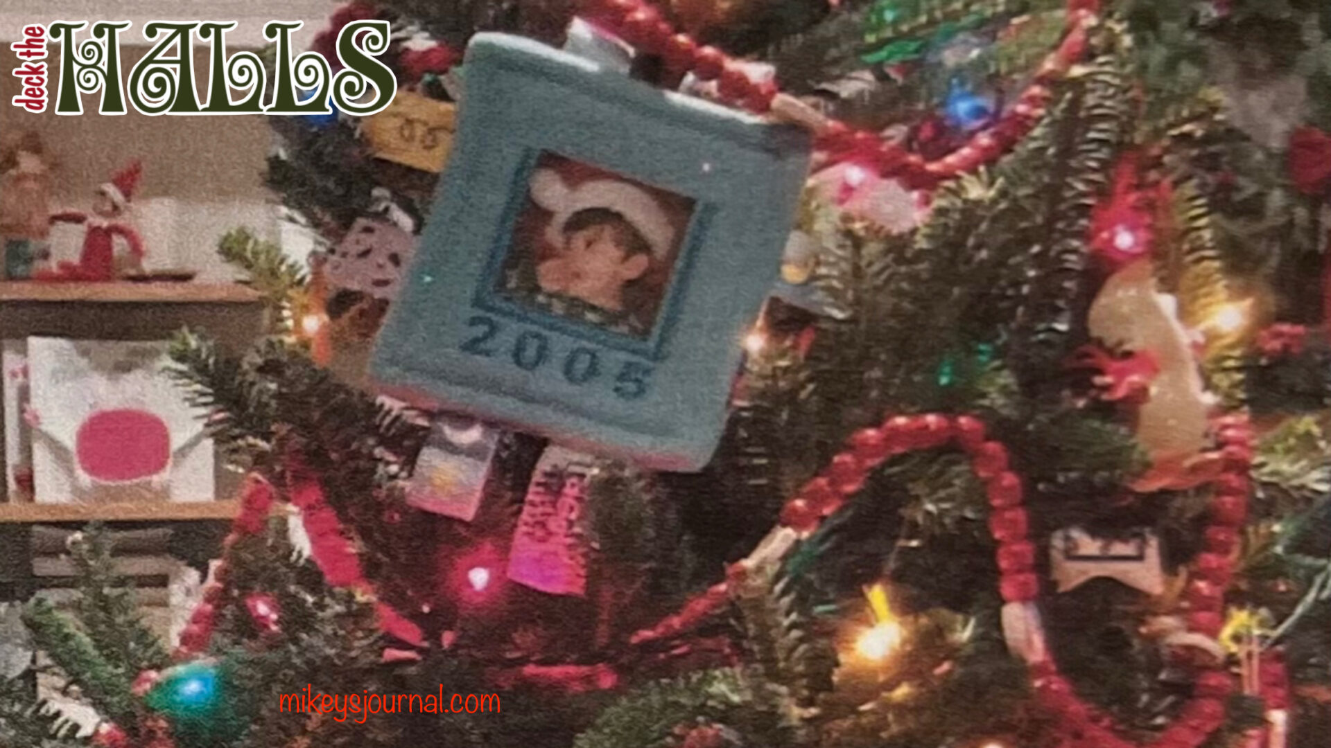 Close up of the decorated tree with Michael’s taggie ornament (a small blanket surrounded by tags with his photo in the middle)
