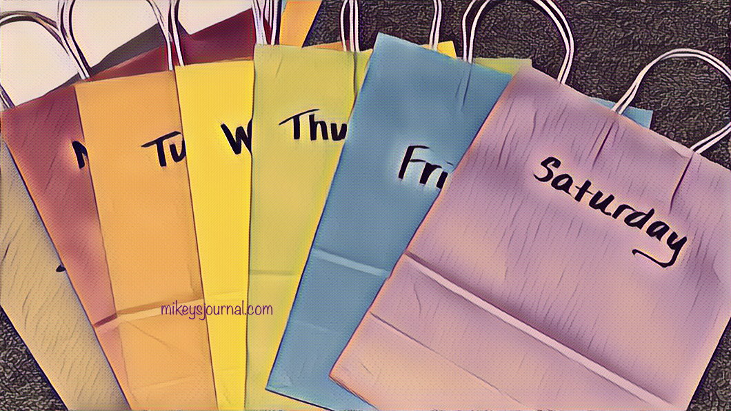 a rainbow assortment of gift bags, each labeled with the day of the week