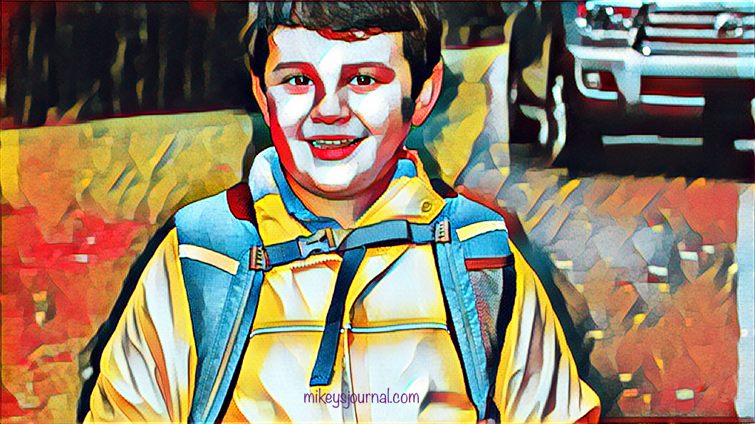 stylized photo of Mikey in a raincoat and a backpack clipped across his chest