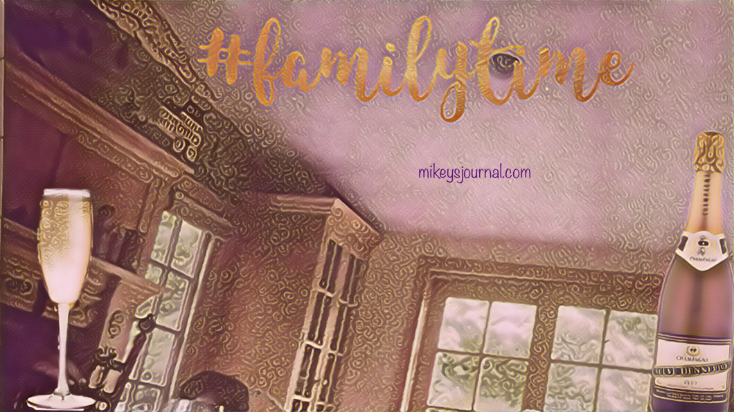 ABC75DF9-2CD4-41B5-900A-4684CE91FC58 stylized photo of an interior room of a house with the hashtag familytime. sticker of a champagne bottle and glass for fun.
