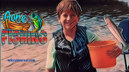 stylized photo of Will, wearing his life jacket, standing in the water with his orange bucket, Gone Fishing Logo and fish sticker added for fun