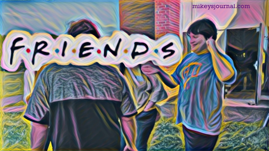 F7DB8FAB-CBE2-4FD0-A6E9-EC13B4DD0045 stylized photo of mikey smiling with a group of friends (friends faces obscured by the friends sign from the TV show)